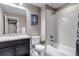 Bathroom featuring a combined shower and tub and a modern vanity at 6746 S Biloxi Ct, Aurora, CO 80016