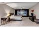 Spacious bedroom featuring a modern entertainment center and a ceiling fan at 6746 S Biloxi Ct, Aurora, CO 80016