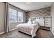 Charming bedroom with large windows and a decorative accent wall at 6746 S Biloxi Ct, Aurora, CO 80016