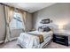 Cozy bedroom features a window that lets in lots of natural light and provides views of the neighborhood at 6746 S Biloxi Ct, Aurora, CO 80016