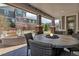 Inviting covered patio with a round fire table and comfortable seating at 6746 S Biloxi Ct, Aurora, CO 80016
