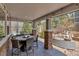 Spacious covered patio with outdoor kitchen, fire table, and seating at 6746 S Biloxi Ct, Aurora, CO 80016