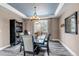 Formal dining room with stylish decor, modern lighting, and elegant table setting at 6746 S Biloxi Ct, Aurora, CO 80016
