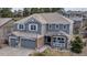 Beautiful two-story home featuring a well-maintained lawn, brick accents, and a welcoming front porch at 6746 S Biloxi Ct, Aurora, CO 80016