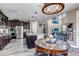 Open kitchen featuring stainless steel appliances, a large island, and a view into the dining area at 6746 S Biloxi Ct, Aurora, CO 80016