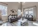 Bright and airy living room with modern decor, large windows, and comfortable seating at 6746 S Biloxi Ct, Aurora, CO 80016