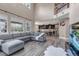 Expansive open-concept living room with high ceilings, large windows, and seamless flow to the kitchen at 6746 S Biloxi Ct, Aurora, CO 80016