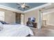 Spacious main bedroom with large bed and barn door leading to bathroom at 6746 S Biloxi Ct, Aurora, CO 80016