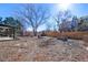 Large backyard offering a patio area and gardening space with mature trees at 2154 S Joplin Way, Aurora, CO 80013