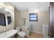 Bathroom with a pedestal sink, toilet and a washer and dryer at 2154 S Joplin Way, Aurora, CO 80013