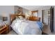 Bedroom featuring a serene ambiance, dresser, and a nice view through the window at 2154 S Joplin Way, Aurora, CO 80013
