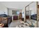 Bedroom with a cozy crib, changing table, decor, and mirror sliding closet at 2154 S Joplin Way, Aurora, CO 80013