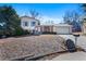Charming split-level home with brick and siding, a well-manicured lawn, and an attached two-car garage at 2154 S Joplin Way, Aurora, CO 80013