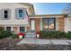A charming front entrance with a brick facade, inviting entryway, and manicured landscaping at 2154 S Joplin Way, Aurora, CO 80013