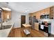 Modern kitchen featuring stainless steel appliances, light wood cabinets, and hardwood floors at 2154 S Joplin Way, Aurora, CO 80013