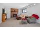 Cozy living room with brick fireplace, neutral carpet and comfortable seating at 2154 S Joplin Way, Aurora, CO 80013