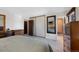 Bedroom featuring a large closet, dressers, and access to the bathroom at 2154 S Joplin Way, Aurora, CO 80013