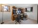 Office space with desk, bookcases, multiple monitors and two windows at 2154 S Joplin Way, Aurora, CO 80013