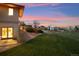 Beautiful backyard featuring a lush green lawn and a patio area that is ideal for gatherings at 4305 Easley Rd, Golden, CO 80403