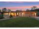Stunning home with a three-car garage, beautiful landscaping, and a lush green lawn at 4305 Easley Rd, Golden, CO 80403