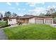 Well-manicured front yard and three-car garage enhance this beautiful home at 4305 Easley Rd, Golden, CO 80403