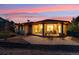 Inviting covered patio with comfortable seating and a barbecue area, perfect for outdoor living at 4305 Easley Rd, Golden, CO 80403