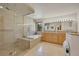 Elegant bathroom featuring a luxurious tub, seamless glass shower, and vanity at 5808 Crestbrook Cir, Morrison, CO 80465