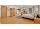 Cozy bedroom with wood floors, wardrobe, and a view to the outdoor space at 5808 Crestbrook Cir, Morrison, CO 80465