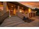 Brick home featuring a charming front entrance with autumn decorations and professional landscaping at 5808 Crestbrook Cir, Morrison, CO 80465