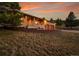 A well-maintained home with a brick exterior, two-car garage, and professionally landscaped yard at 5808 Crestbrook Cir, Morrison, CO 80465