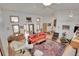 Spacious living area with a large rug, hardwood floors, and ample natural light at 5808 Crestbrook Cir, Morrison, CO 80465