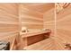 Cozy sauna with wooden walls and bench seating, featuring a bucket and scoop for traditional use at 5808 Crestbrook Cir, Morrison, CO 80465