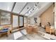 Bright sunroom with tile floor, paneled glass ceiling, telescope, and sitting area at 5808 Crestbrook Cir, Morrison, CO 80465