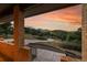 A scenic mountain view from the porch of a brick home, showcasing the natural surroundings at 5808 Crestbrook Cir, Morrison, CO 80465