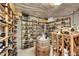 Basement wine cellar with racked shelving and wooden wine barrel at 5808 Crestbrook Cir, Morrison, CO 80465