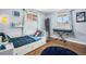 ' bedroom with natural light, a full sized bed, piano, and moon decor at 241 S 15Th Ave, Brighton, CO 80601