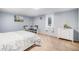Cozy bedroom with carpet, a white dresser, and a bed with a knit blanket at 241 S 15Th Ave, Brighton, CO 80601