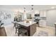 Bright kitchen features stainless appliances, a large island and a dining area at 241 S 15Th Ave, Brighton, CO 80601