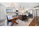 Bright kitchen features stainless appliances, a large island and a dining area at 241 S 15Th Ave, Brighton, CO 80601