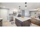 Bright kitchen features stainless appliances and a large island at 241 S 15Th Ave, Brighton, CO 80601