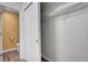Walk-in closet with hanging rods and shelves, located near the toilet at 2181 S Troy Way # 103, Aurora, CO 80014