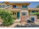 Well-kept townhome featuring a charming front entryway and lush greenery at 2181 S Troy Way # 103, Aurora, CO 80014