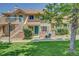 Charming townhome with a well-manicured lawn and an inviting entryway at 2181 S Troy Way # 103, Aurora, CO 80014