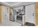 Kitchen with stainless steel appliances and a door leading to the laundry room at 2181 S Troy Way # 103, Aurora, CO 80014