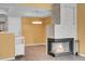 Living room featuring stone fireplace, light fixture and adjacent dining area at 2181 S Troy Way # 103, Aurora, CO 80014