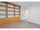 Open concept living space with custom built-ins, modern flooring, and bright white walls at 285 Clementina St, Louisville, CO 80027