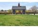 Community barn with picnic tables and green space for outdoor enjoyment at 285 Clementina St, Louisville, CO 80027