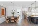 Open-concept dining area featuring a round table and contemporary decor at 285 Clementina St, Louisville, CO 80027