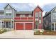 Beautiful two-story red home with a two-car garage and second story deck at 285 Clementina St, Louisville, CO 80027