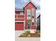 A modern-style two-story red home with a front entrance featuring stylish accents at 285 Clementina St, Louisville, CO 80027